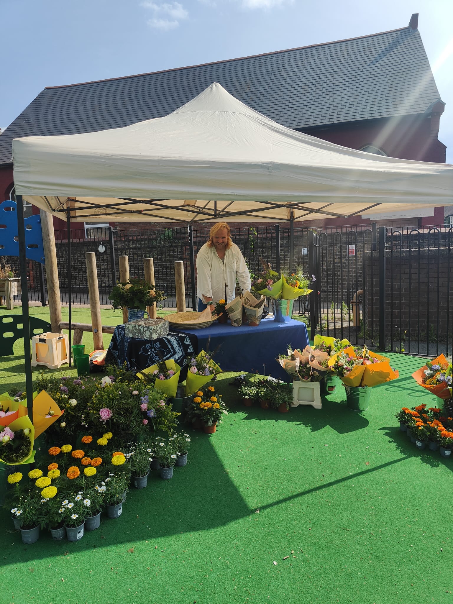 Traders and shoppers at West Green Market